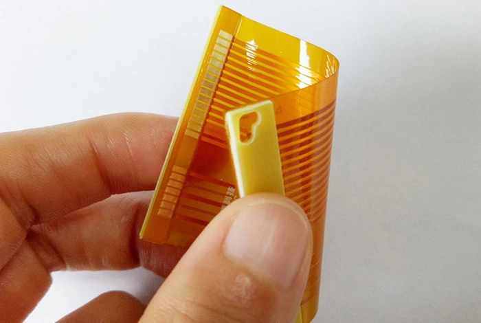 Hand-holding-a-rolled-flexible-PCB.jpg